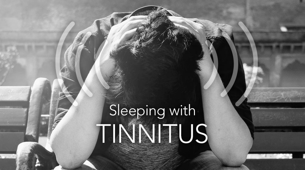 Man with ringing in ears struggles to fall asleep with tinnitus. His solution for falling asleep with tinnitus is SleepPhones® comfortable headband headphones.